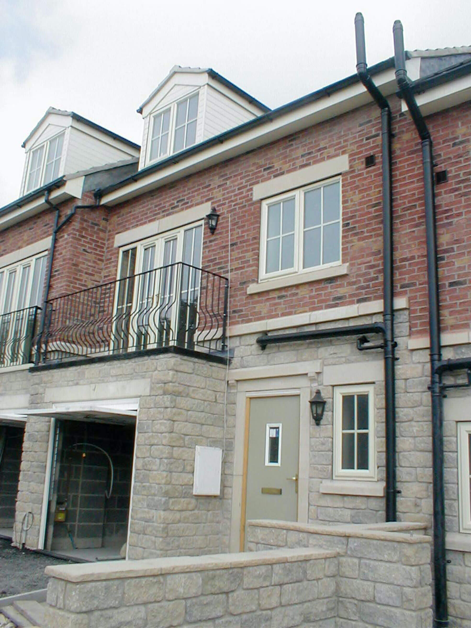 Modern building with balcony and customised windows and doors