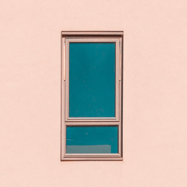 Window on a light pale pink wall